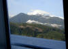 21Apr: Through port window: Vancouver Island at Johnstone Strait, Inside Passage, BC